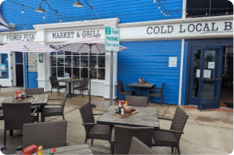 local fish shop from outside with tables and chairs