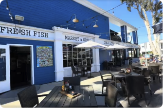 local fish shop from outside with tables